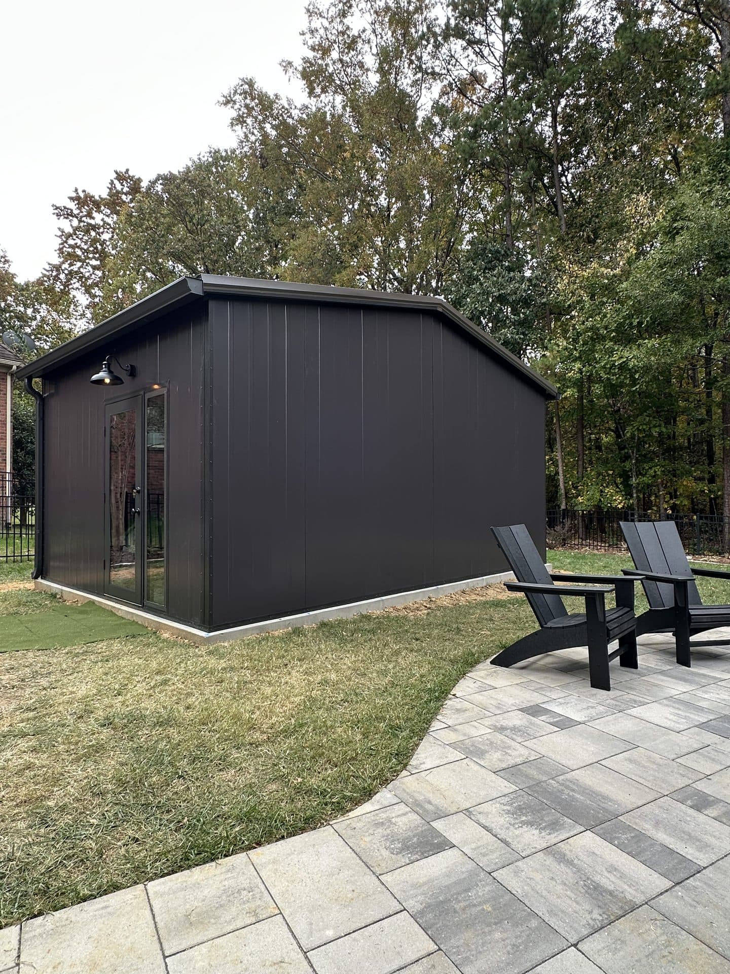 GSR outbuilding with paver path and chairs