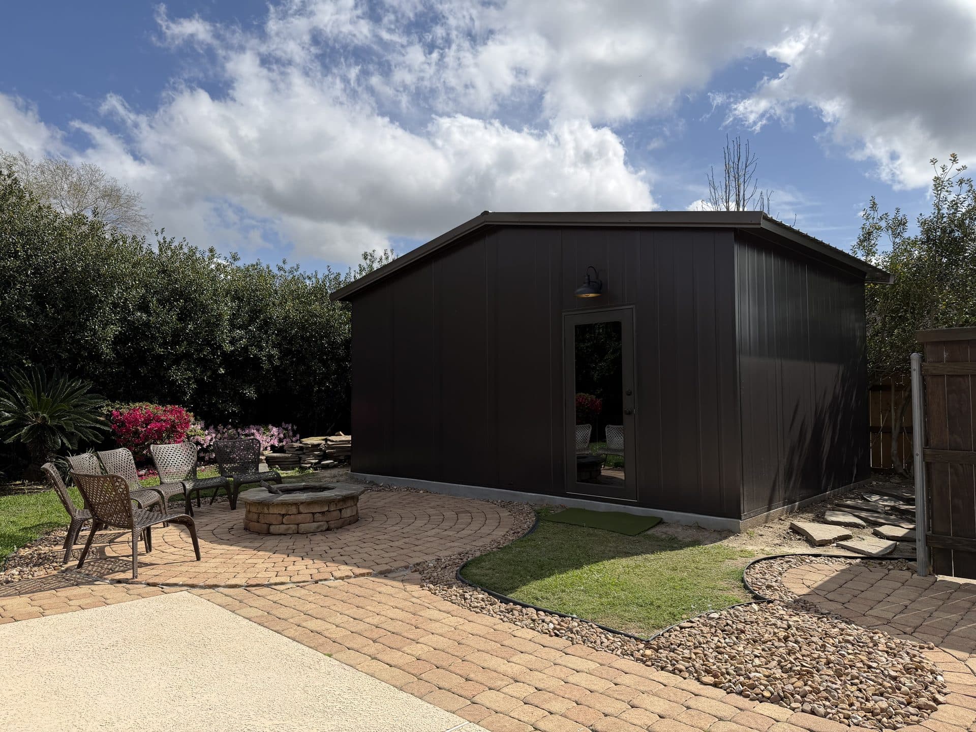 GSR golf simulator outbuilding with landscaped patio